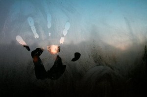 handprint on frosted window pane